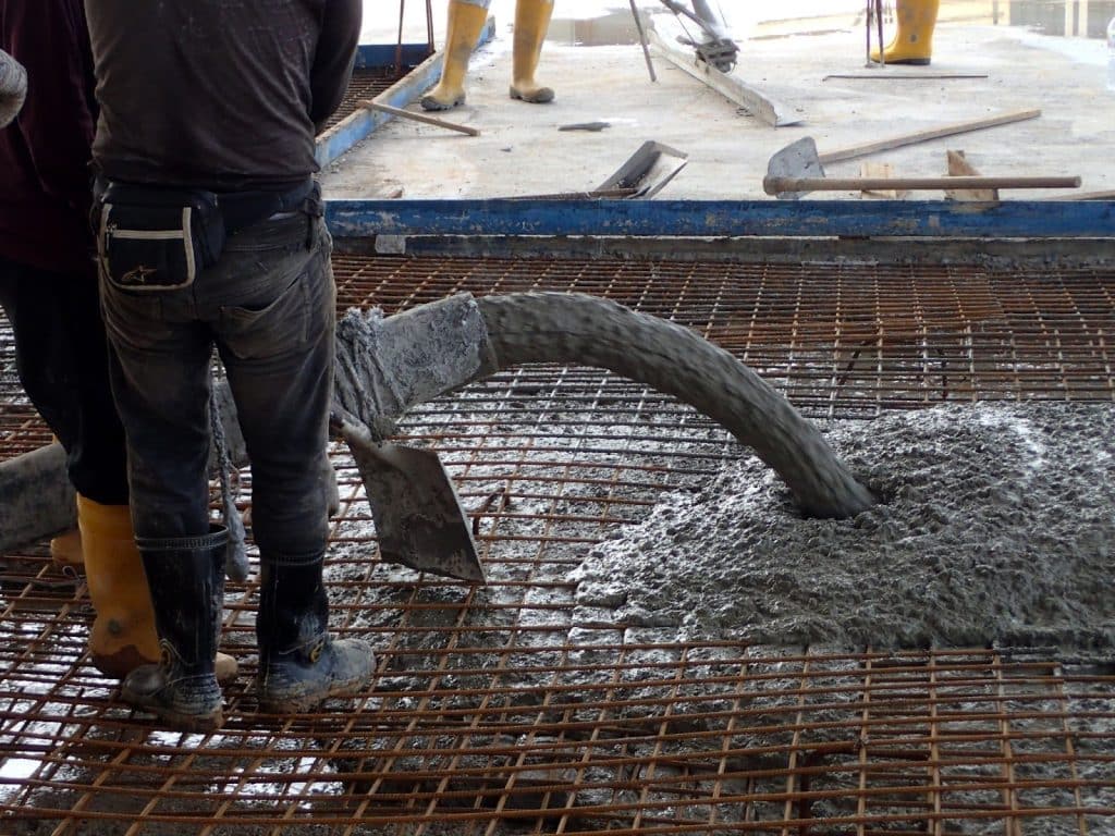 construction professional pouring cement 