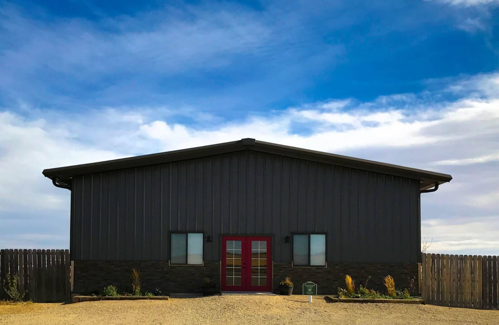 Brown metal building with A-frame roof
